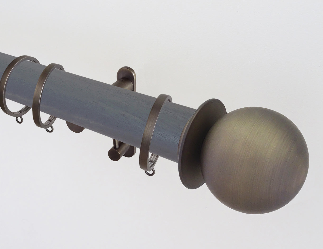 50mm diameter stained wooden curtain pole with metal ball finials and brackets