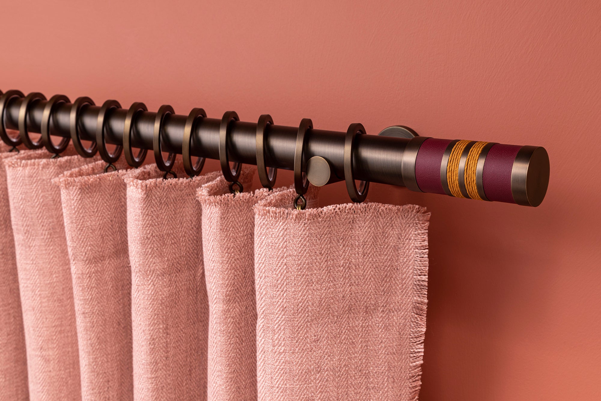 Antique brass curtain pole with handmade bobbin finials in vibrant colours | Walcot House UK