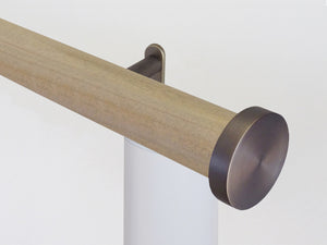 Motorised wooden curtain pole in light oak stain and bronze hardware | Walcot House UK
