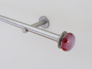 Designer stainless steel curtain pole set with coloured glass lunar finials in crimson red | Walcot House