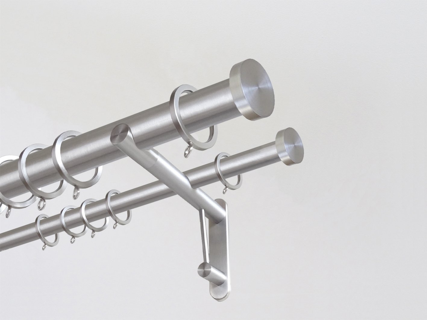 Double 30mm diameter stainless steel curtain pole system with Mini Disc finials