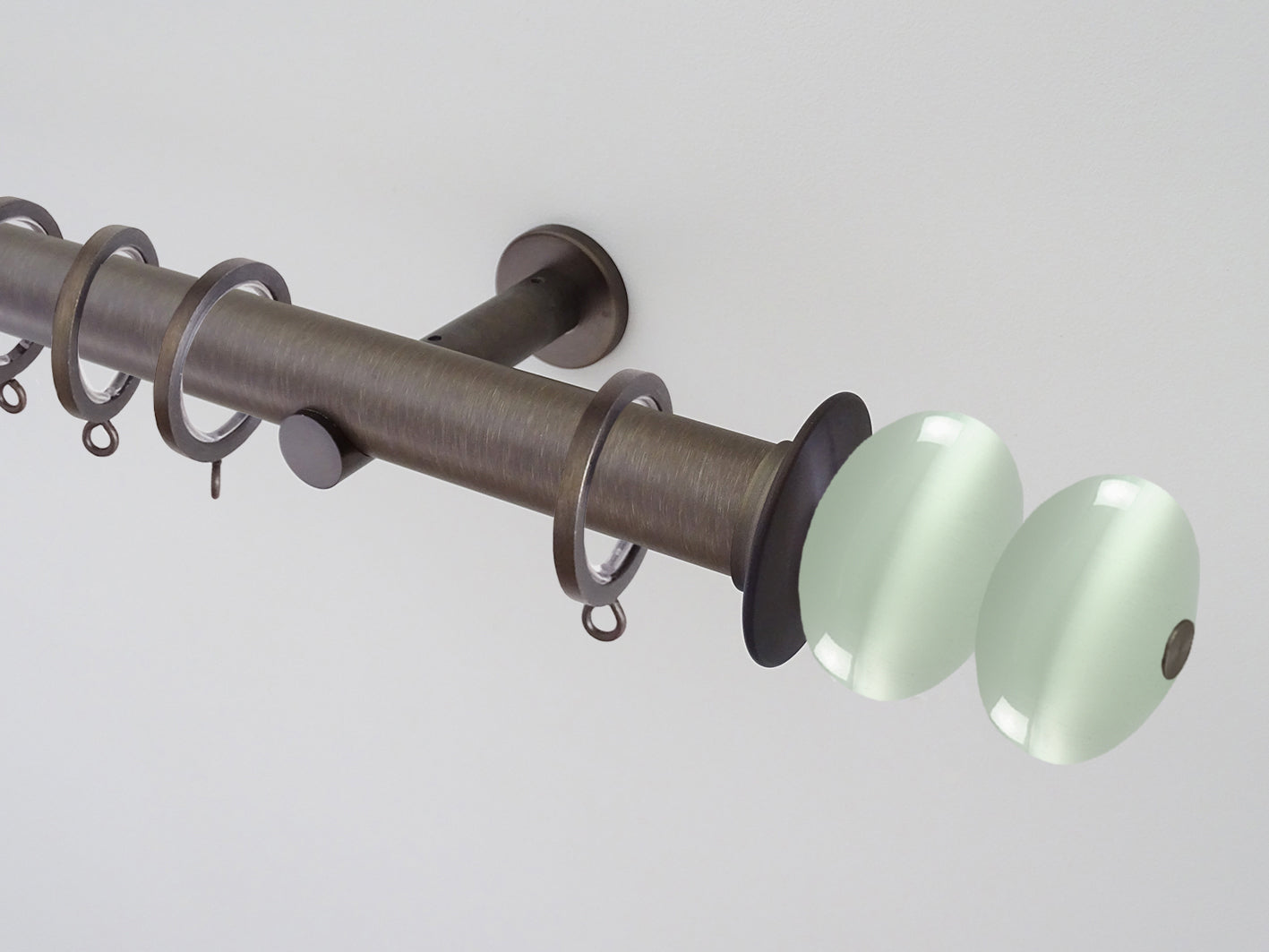 Antique brass curtain pole set with glass moonstone finials | Walcot House