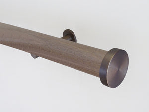 Weathered oak stained wooden tracked curtain pole with acrylic ball finials