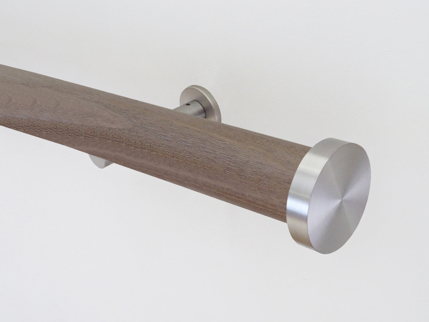 Weathered oak stained wooden tracked curtain pole with acrylic ball finials