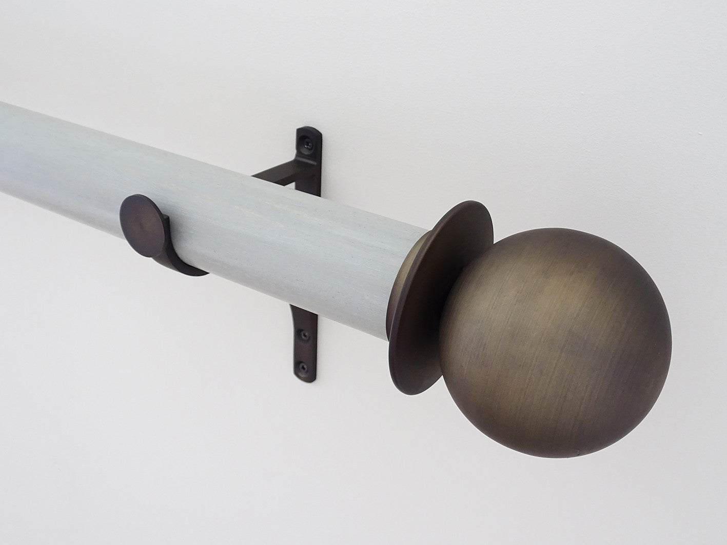 Metal ball finial in brushed bronze, mounted on 50mm "wood pidgeon" stained wood pole set