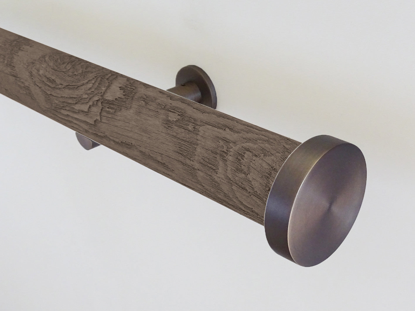 wrapped and tracked curtain pole in driftwood textured brazil nut by Walcot House