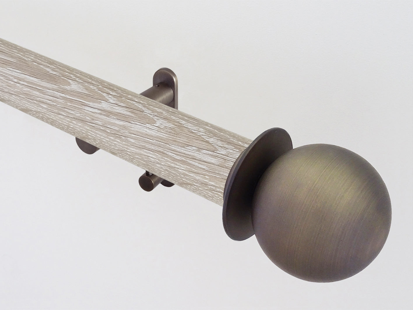 Real solid limed oak tracked curtain pole with metal ball finials | Walcot House