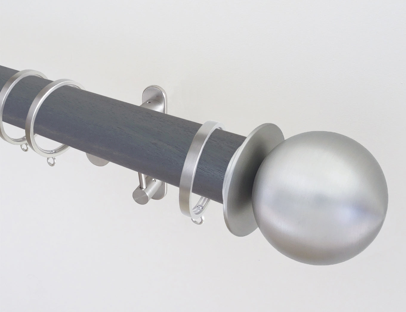 50mm diameter stained wooden curtain pole with metal ball finials and brackets