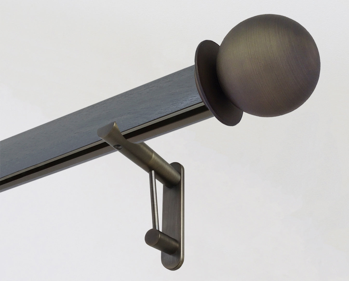 Dark grey tracked curtain pole with bronze ball finials