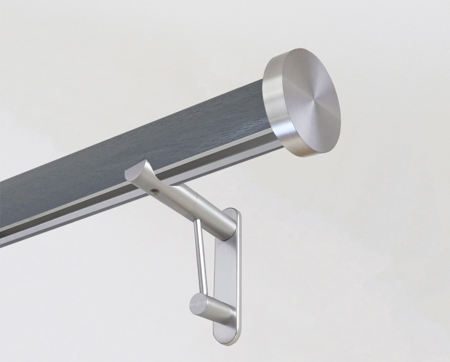 Dark grey tracked curtain pole with bronze end cap finials