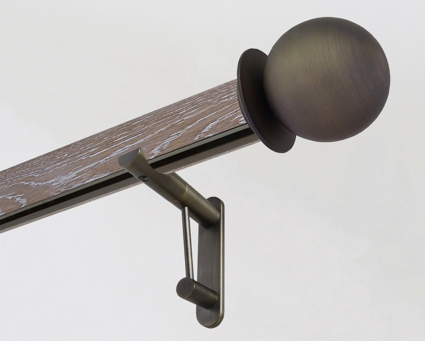 Solid oak curtain pole in tawny brown, with integrated track and metal ball finials | Walcot House