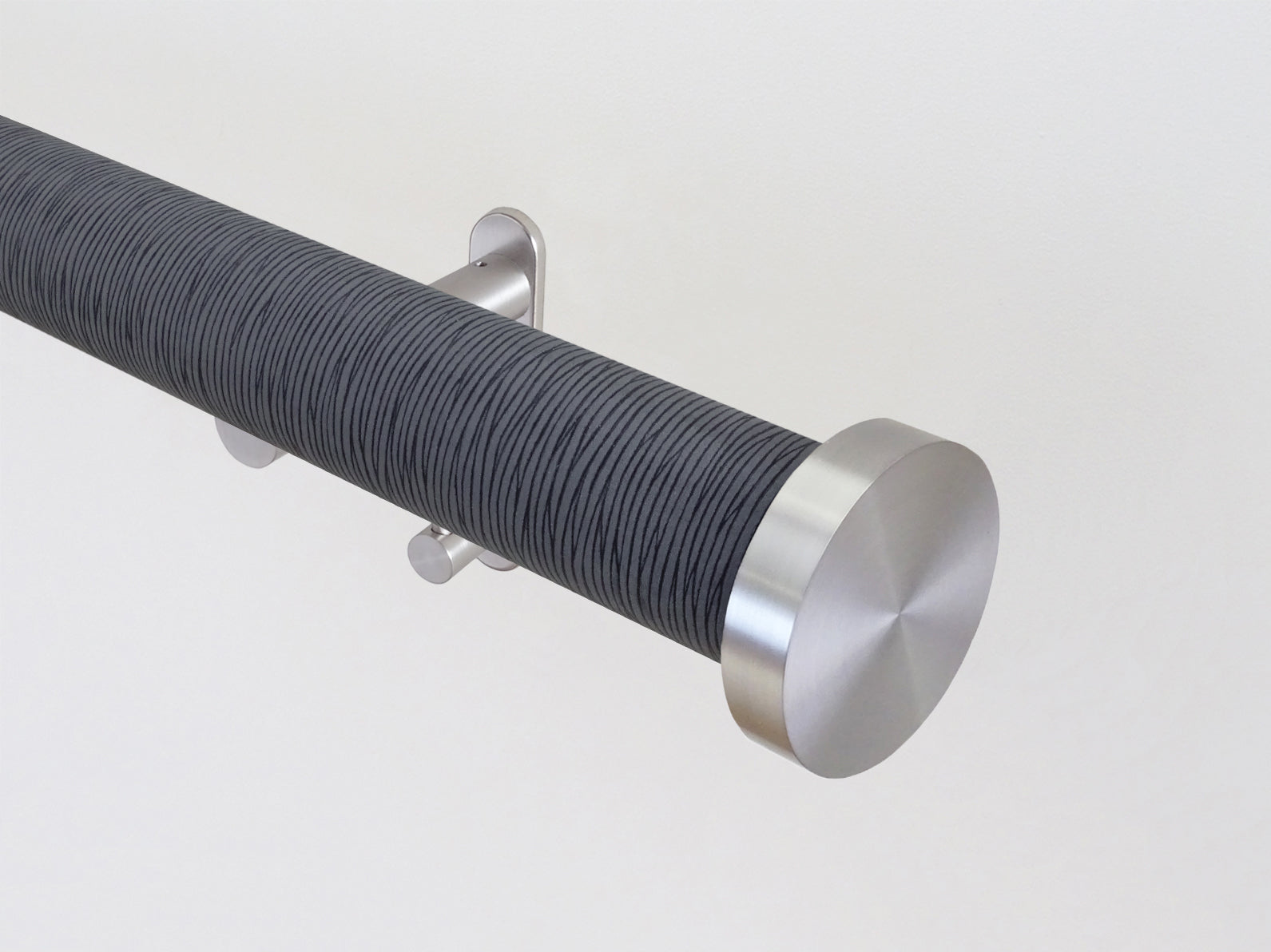 wrapped & tracked curtain pole set in dark blue strata "flint" by Walcot House