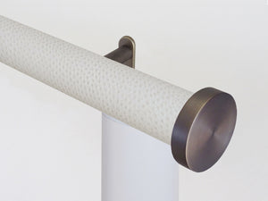Motorised electric curtain pole in white ostrich, wireless & battery powered using the Somfy Glydea track | Walcot House UK curtain pole specialists
