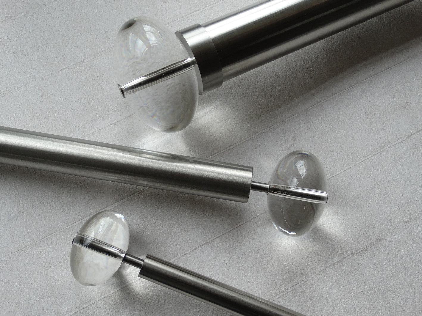 Stainless steel metal curtain pole sets with elliptical acrylic finials